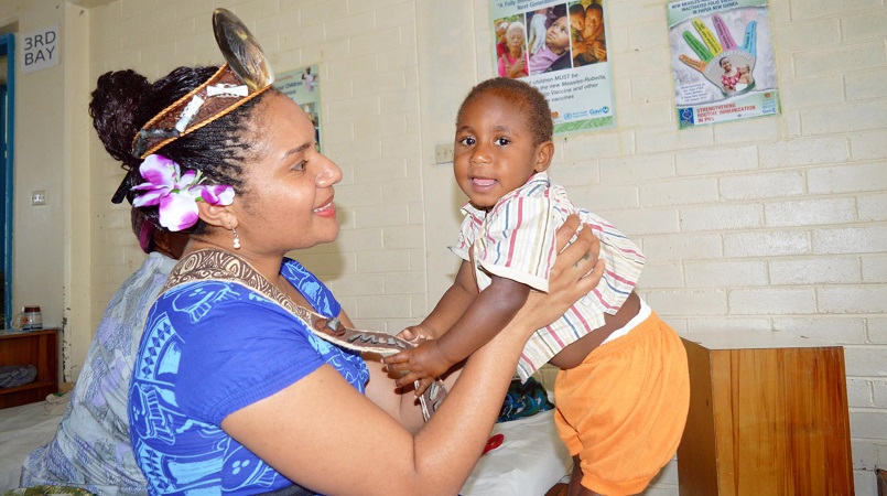 Grace Nugi holds child at Goroka Hospital