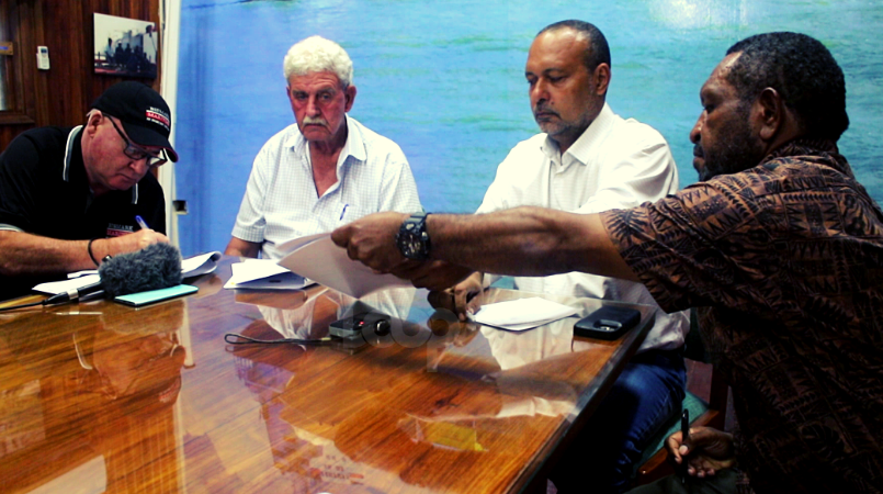 During the signing of the MoU. From left: Bismark sales manager, Adrian Brookes, Bismark MD, Hamish Sharp, Commerce Minister, Sam Basil and Cooperative Societies of PNG Registrar, Joseph Ingipa