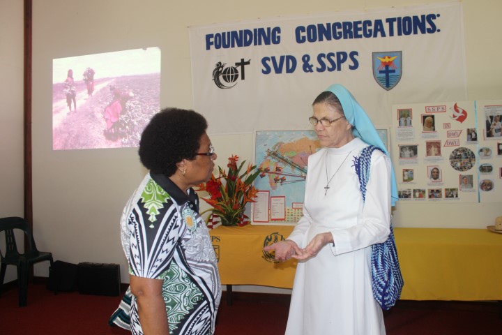 01.	One of the Catholic missionaries serving in DWU, Associate Professor Sister Miriam Dlugosz PhD (right) with DWU President Professor Cecilia Nembou PhD at the display area of the Mission and Identity Directorate on Open Day. Photo by Dr KEVIN PAMBA