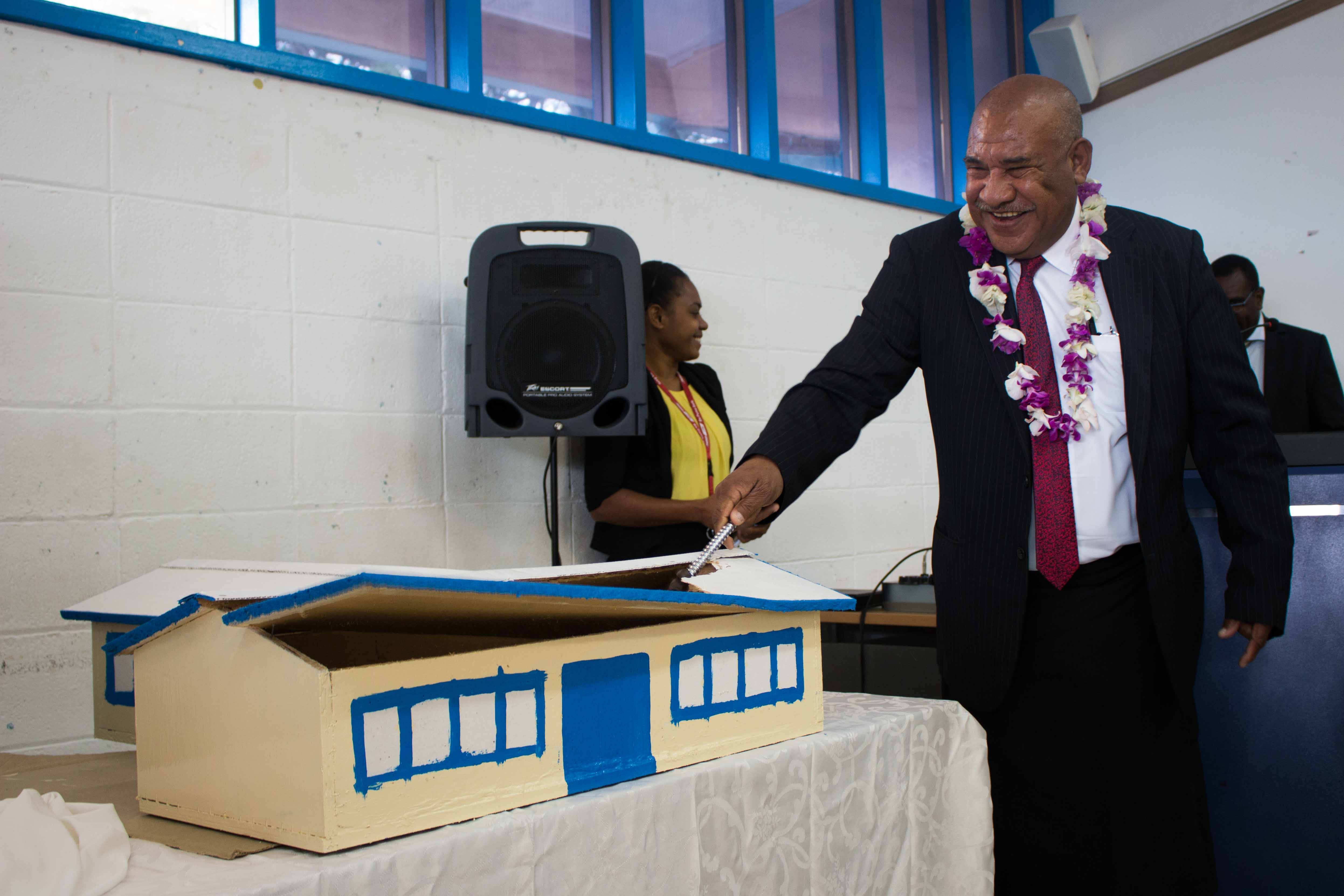 DPM Secretary Kali symbolically demolished a model of the old PNGIPA Library that is to be replaced