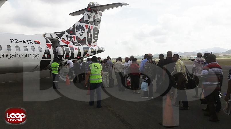 MPs boarding the Alotau-bound flight