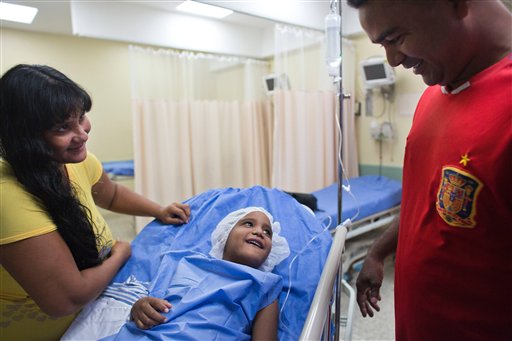 Yin Carlos smiles at his father, Jean Carlos Fernandez, and his mother Gilda Velasquez minutes before a liver transplant surgery