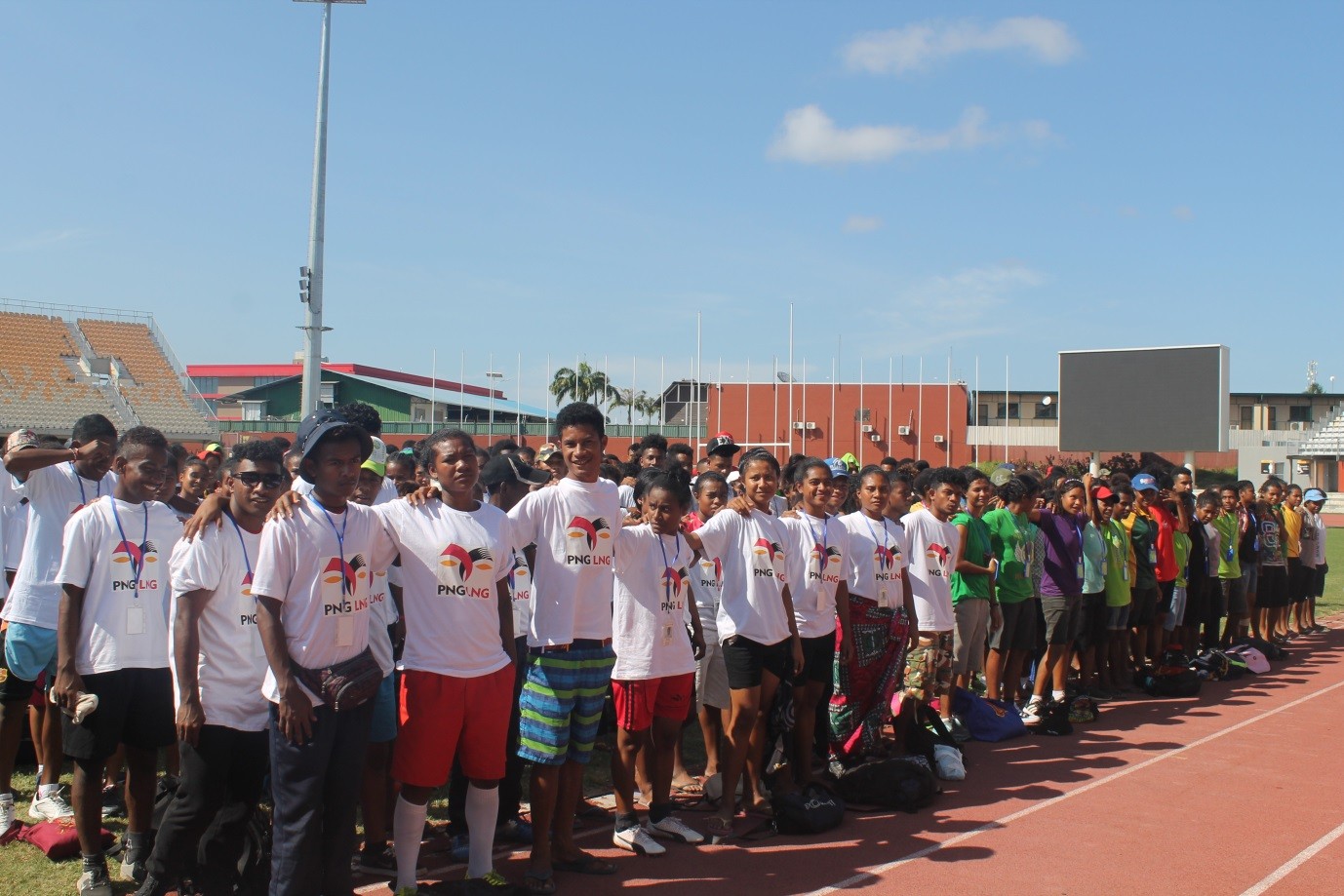 Redscar Day High School students in the LNG Project site area wearing PNG LNG shirts and Mainohana Secondary school students (far end) getting ready for the week long school carnival at Sir John Guise stadium in Port Moresby - Picture by John Iamo, CPG Media