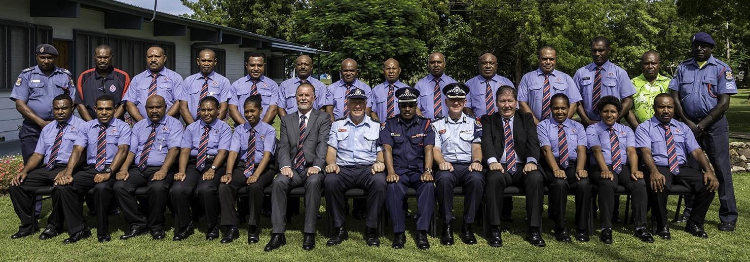The 17 participants from the NCD Criminal Investigation Division with course instructors and AFP personnel, sitting with the Commandant of the Bomana Police College Superintendent Peter Philips (centre)